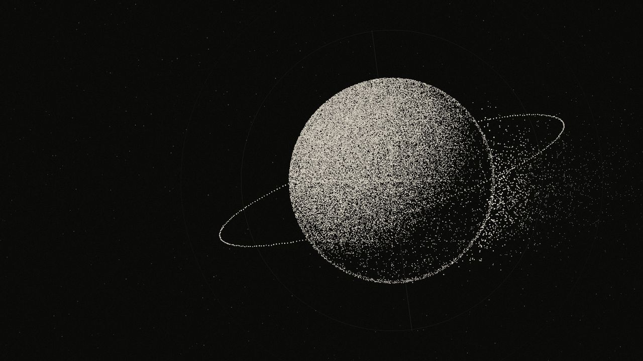 Stippled ivory sphere with an orbital ring, dissolving into particles on one side